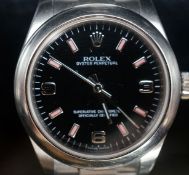 A lady's modern stainless steel Rolex Oyster Perpetual wrist watch, on a stainless steel Rolex