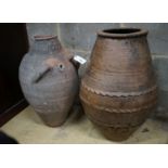 Two Greek style earthenware oil jars, largest height 67cm