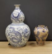 A large Chinese blue and white ‘dragon’ double gourd vase, 64cm high and an Annamese style blue