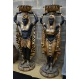 A pair of composition Egyptian style figural planters, height 185cm