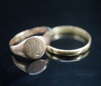 An 18ct gold wedding band, 2.1 grams and a 9ct gold signet ring (cut) 1.7 grams.