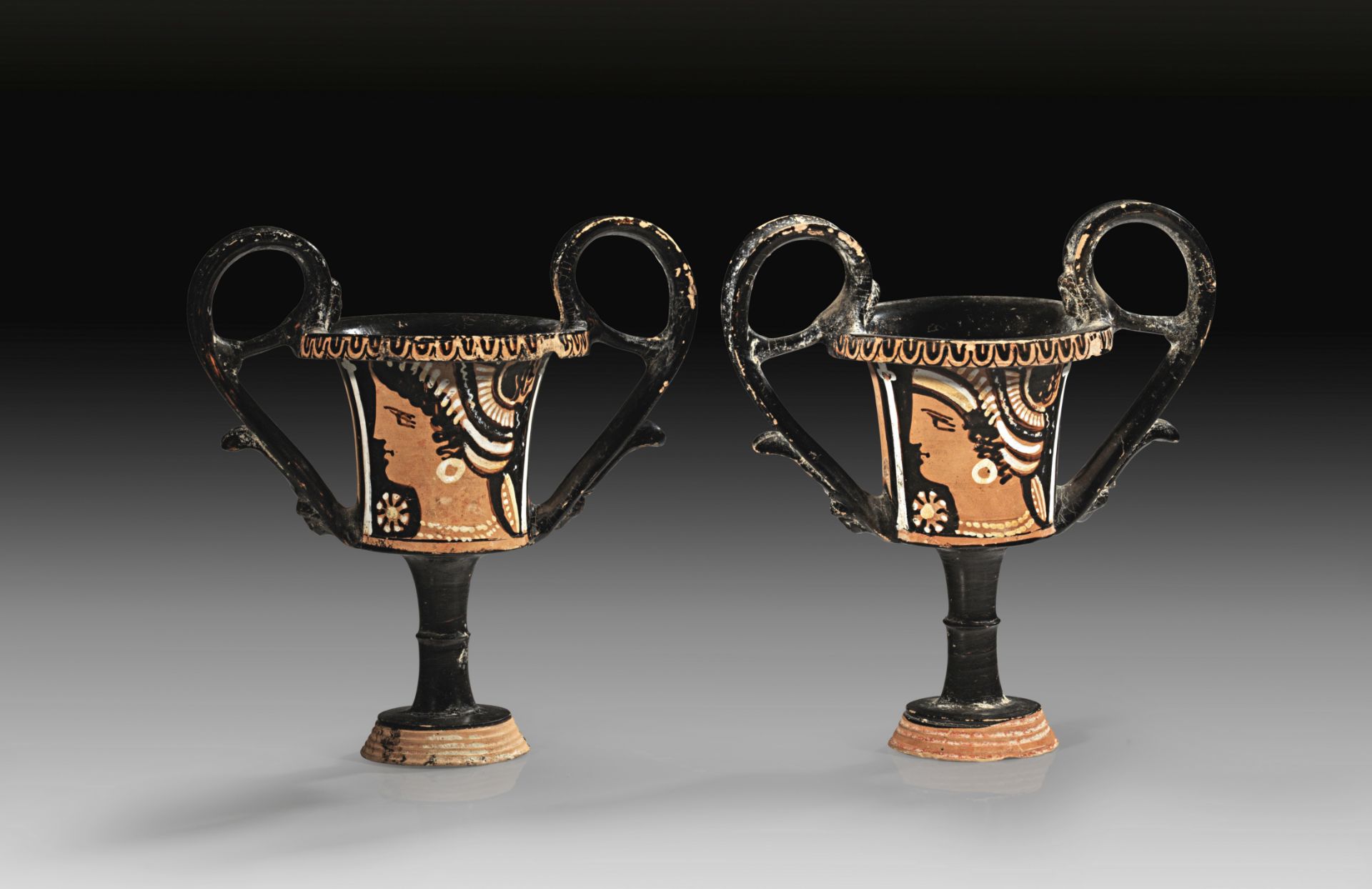 Pair of related red-figured Apulian kantharoi of the Stoke-on-Trent Painter.