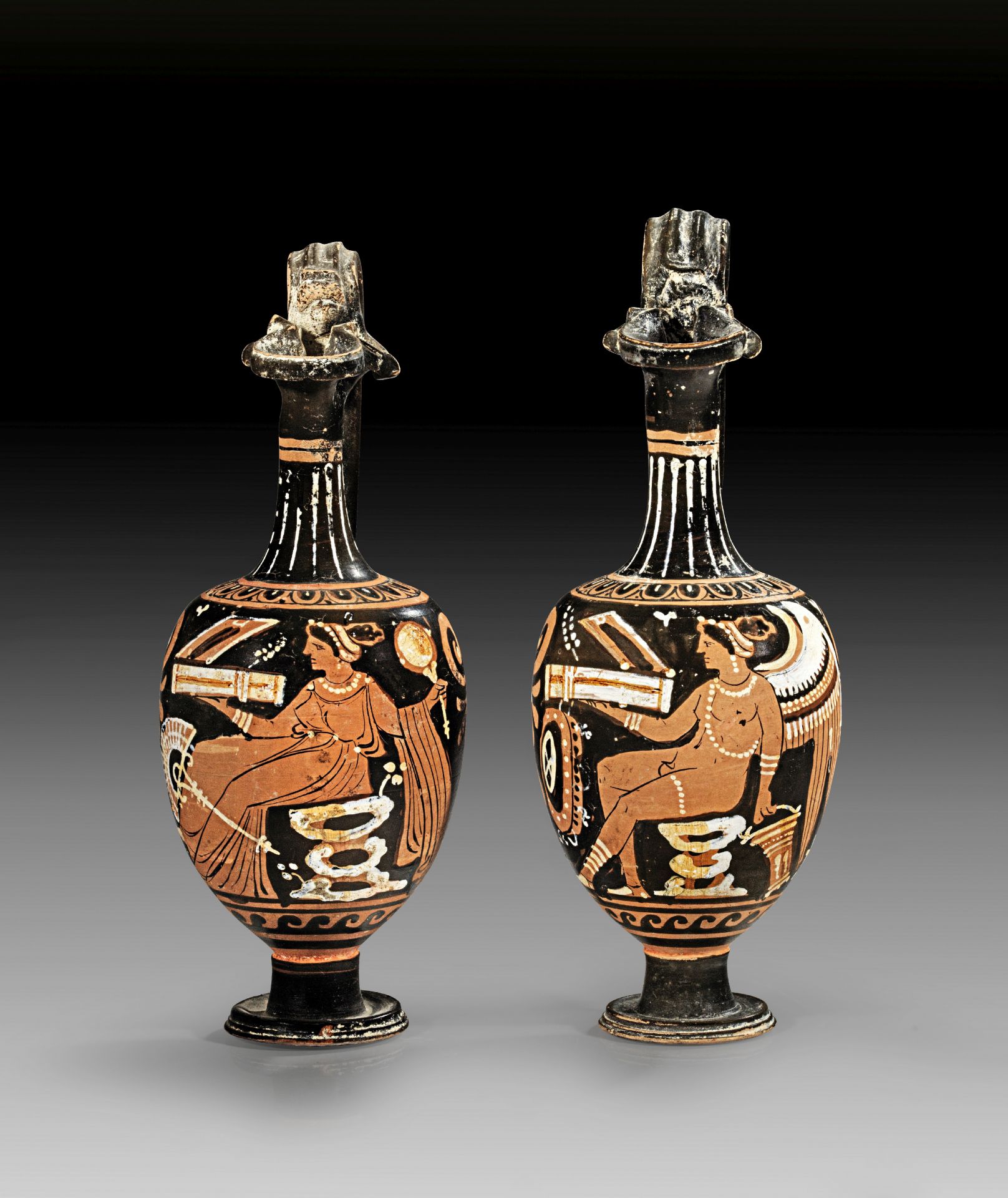 Pair of related red-figured Apulian oinochoes of shape 1 from the Workshop of the Baltimore Painter.