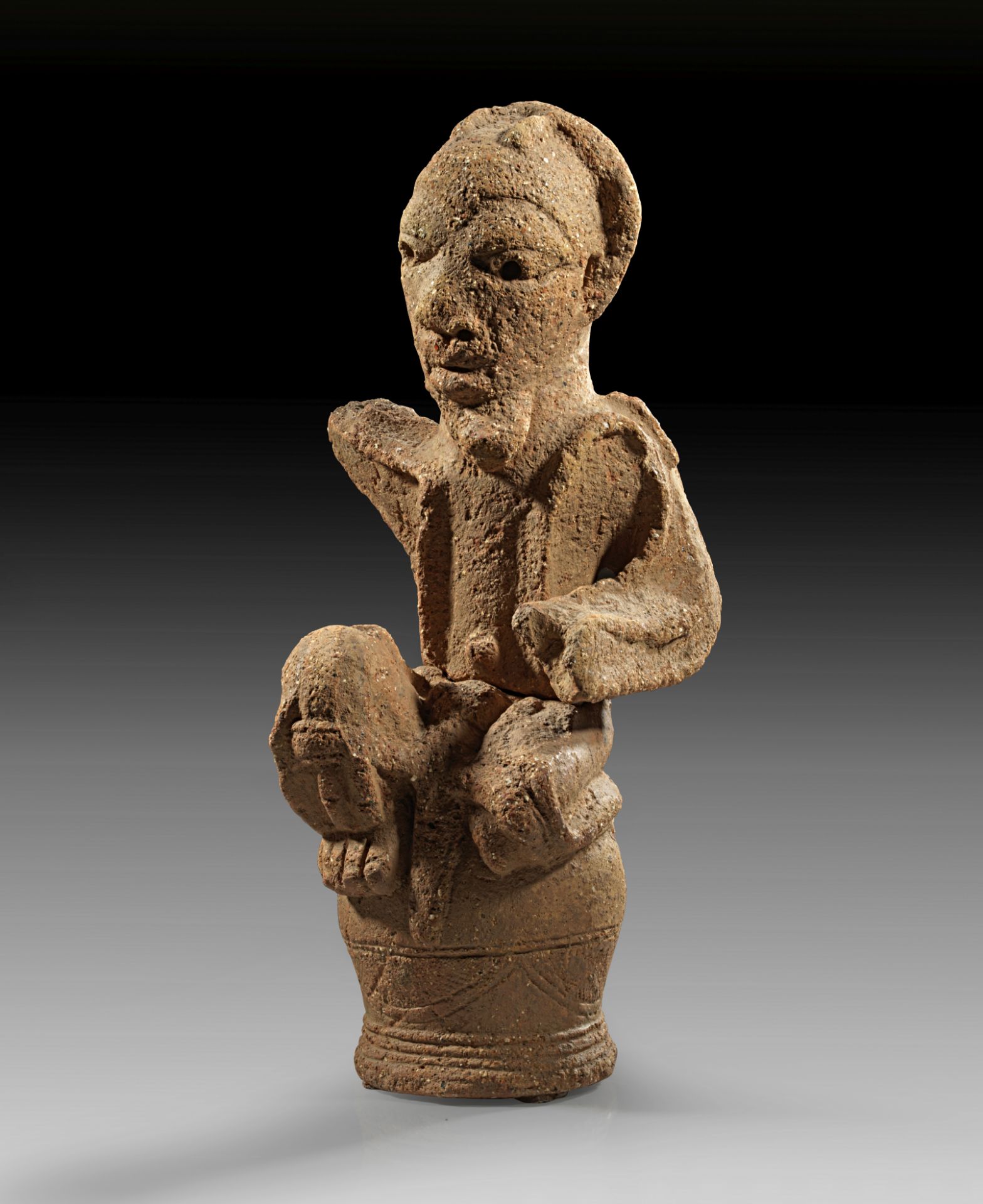 Nok, Nigeria, 500 BC - 200 A.D. terracotta seated figure.