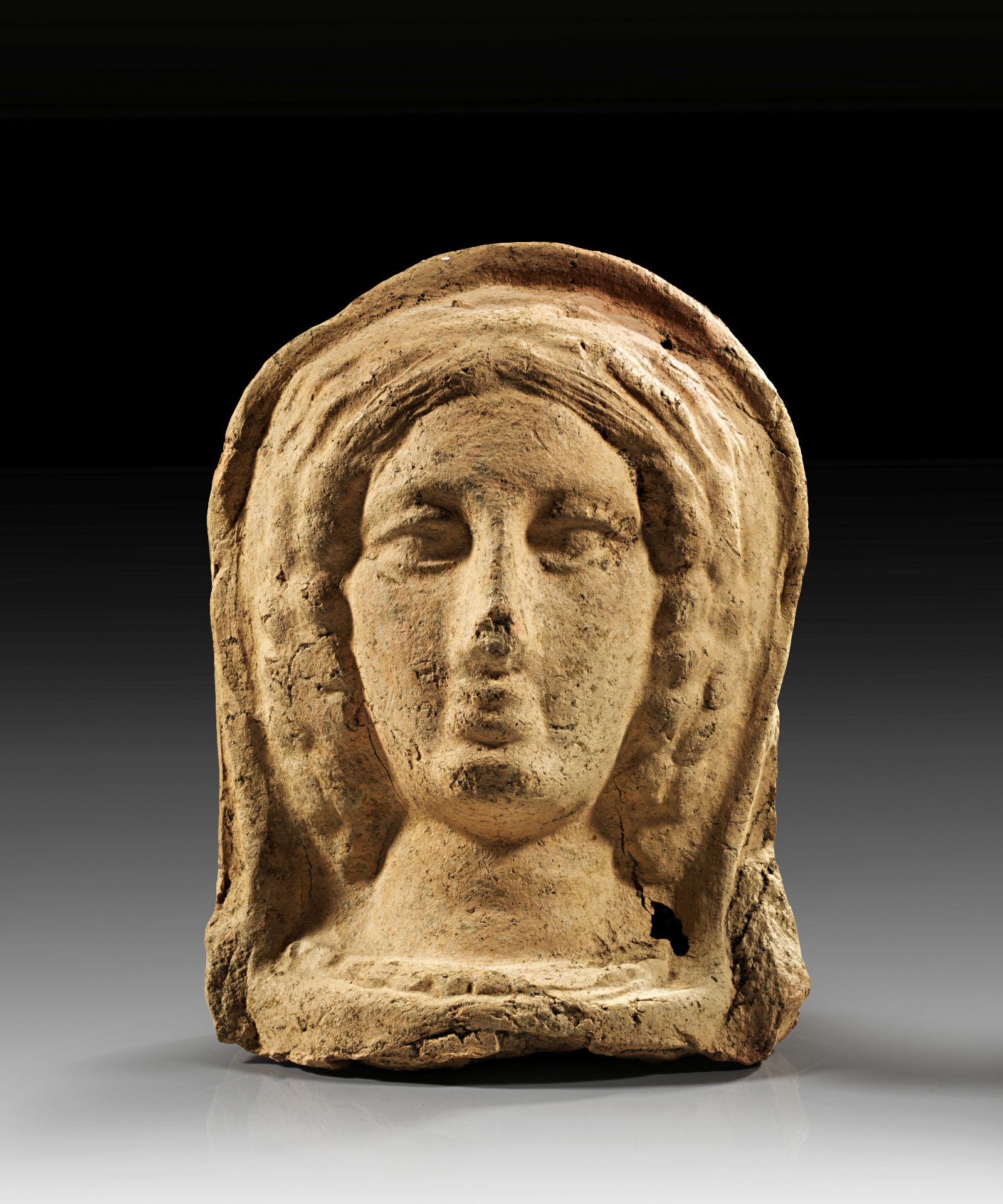Etruskischer Votivkopf eines Mädchens.