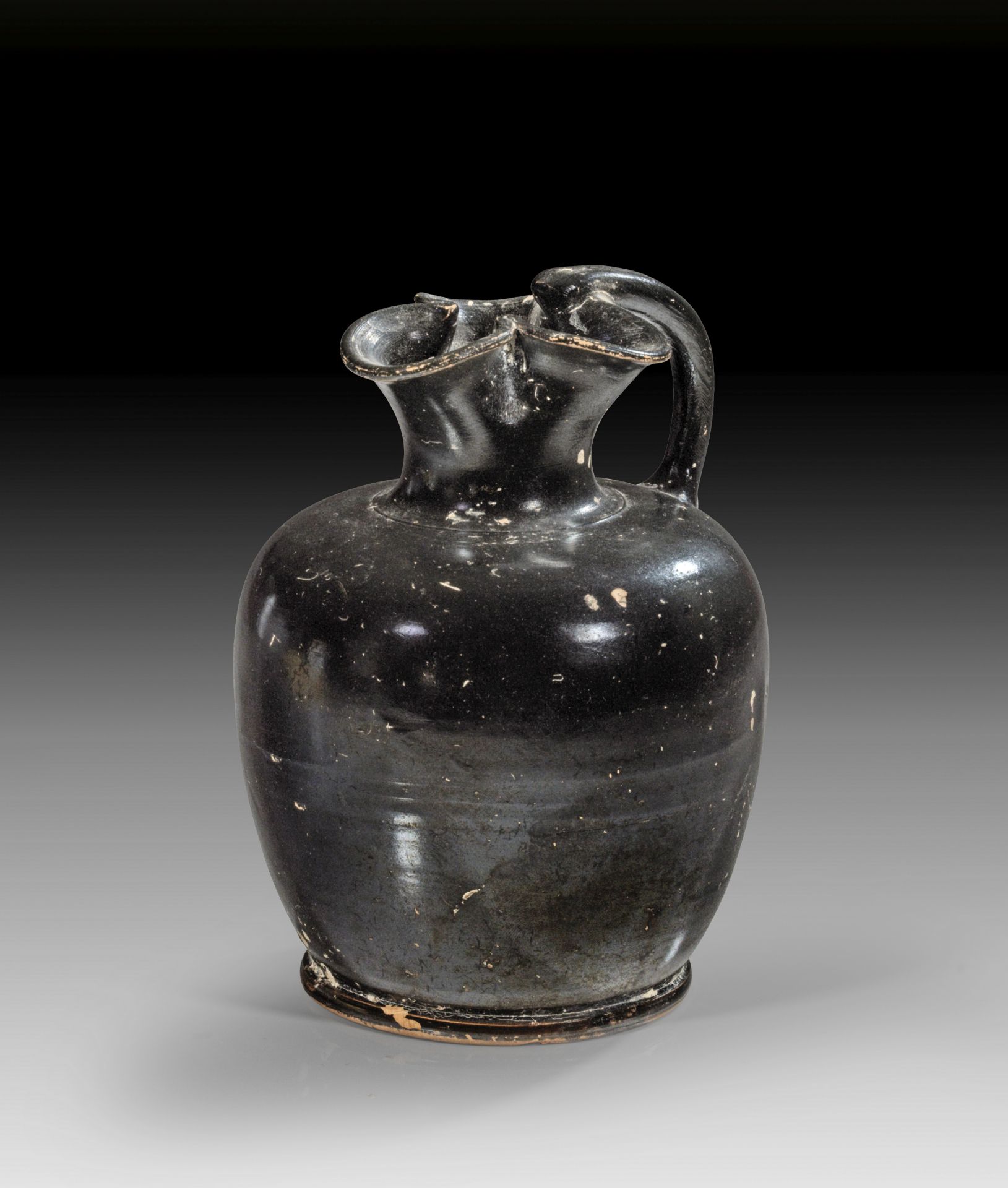 Apulian black-glazed oinochoe of shape 2.