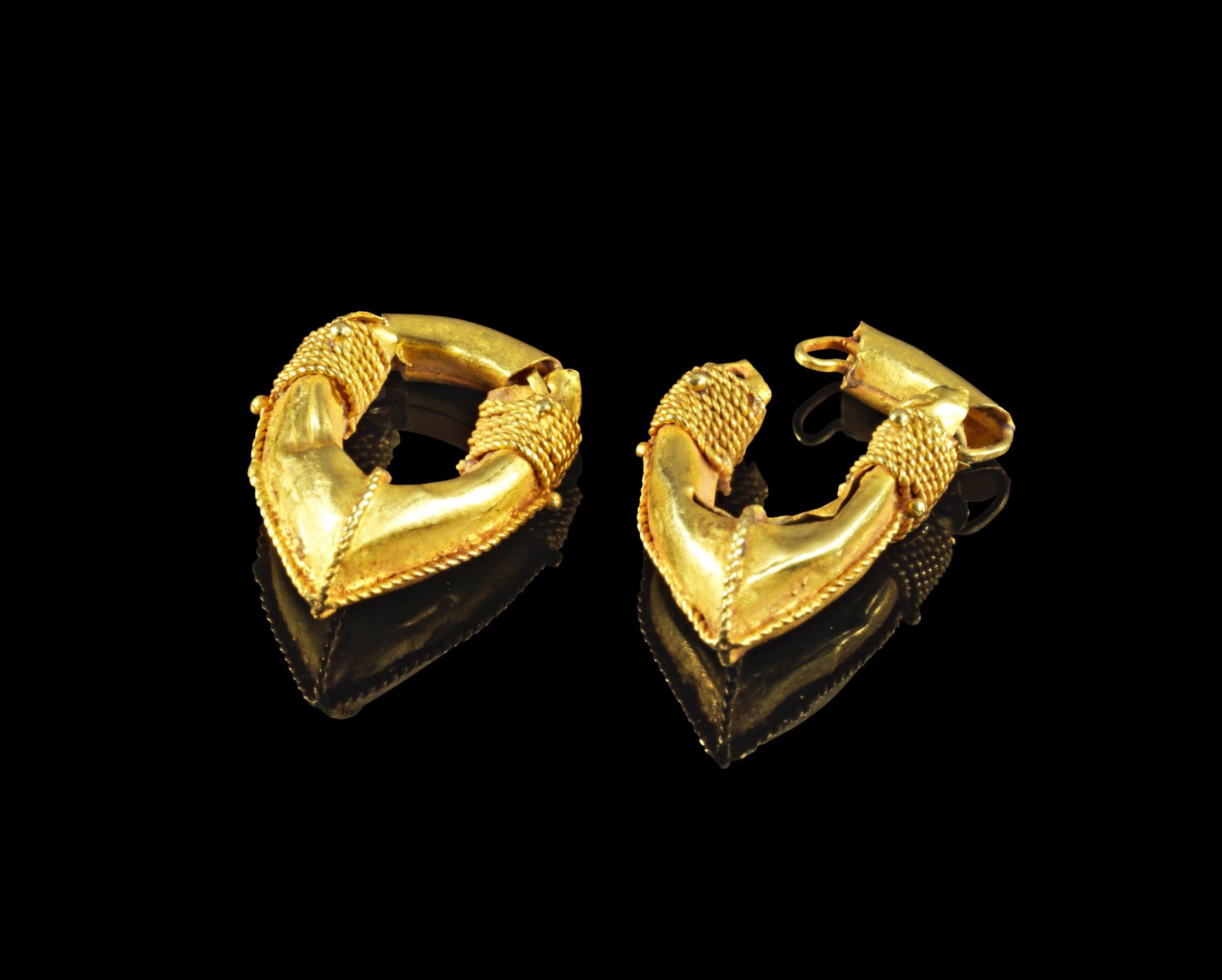 Pair of gold earrings.