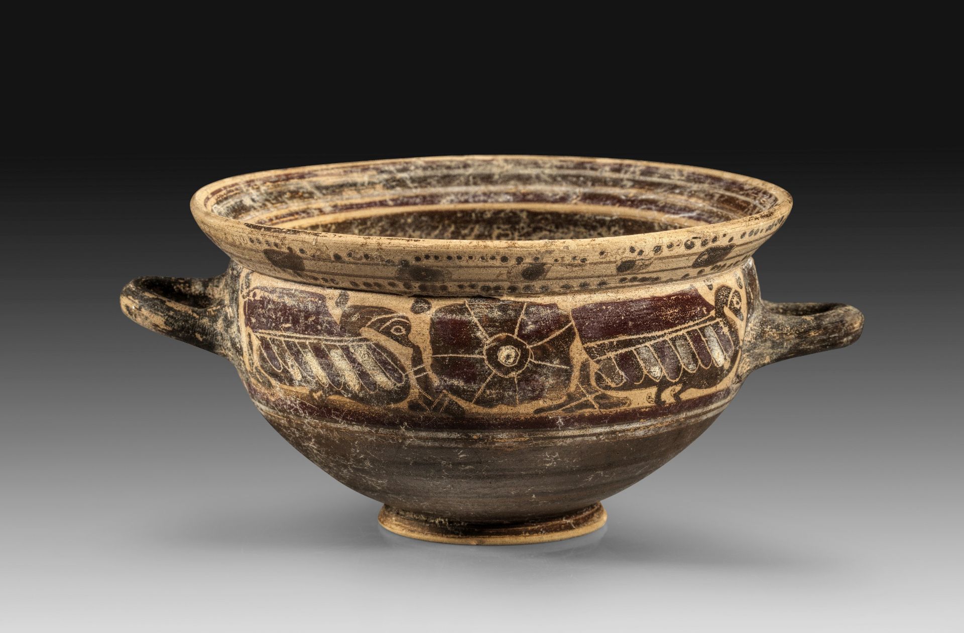 Etrusco-Corinthian black-figure cup.