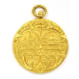 OF MOTOR CYCLING INTEREST. A 9CT GOLD 'MOTOR CYCLING CLUB' MEDALLION The round medallion with the