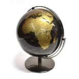 A BLACK AND GOLD TERRESTRIAL GLOBE with gimballed stand, the globe approx 9' diameter, 32cm high