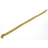 A 9CT GOLD BRACELET The S link bracelet of hollow construction to lobster claw fastener, 19cms