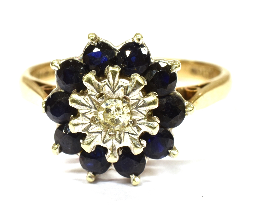 A 9CT GOLD DIAMOND AND SAPPHIRE CLUSTER RING the centre illusion set small diamond with sapphire