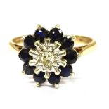 A 9CT GOLD DIAMOND AND SAPPHIRE CLUSTER RING the centre illusion set small diamond with sapphire
