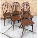 A SET OF SIX ERCOL STICKBACK DINING CHAIRS on H-shape stretcher bases