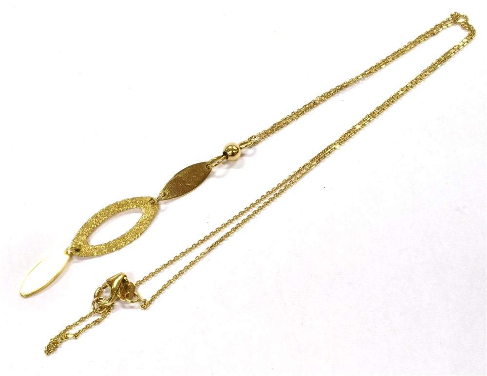 A 9CT GOLD DROP PENDENT AND CHAIN The three section drop 6cms long, soldered loop integral to fine