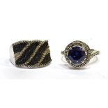 TWO SILVER STONE SET DRESS RINGS comprising a blue and white cubic zirconia round cluster with white
