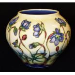 A MOORCROFT 'HEPATICA' PATTERN VASE signed by Emma Bossons and dated '99 to base, further