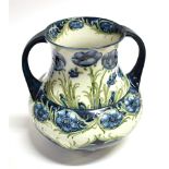 WILLIAM MOORCROFT FOR MACINTYRE POTTERY: a large Florian ware twin-handled vase decorated in the '