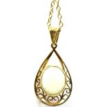 AN OPAL SINGLE STONE 9CT GOLD PENDANT AND CHAIN The oval cabochon cut white opal approx. 12mm x 10mm