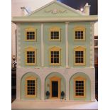 A 1/12 SCALE GEORGIAN STYLE DOUBLE-FRONTED DOLL'S HOUSE the side-hinged front elevation opening to