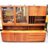 A DANISH ROSEWOOD LOUNGE UNIT the upper section with pair of glazed doors opening to illuminated