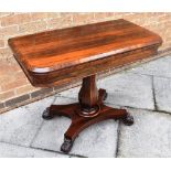 A VICTORIAN ROSEWOOD CARD TABLE on inverted baluster column support and quatrefoil base, 92cm wide