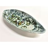 ADAM DWORSKI FOR WYE CLYRO POTTERY: an oval dish with three prong feet, enamelled decoration of a