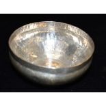 AN ARTS AND CRAFTS DESIGN BOWL of hammered finish with flanged rim (no lid), unmarked, assessed as