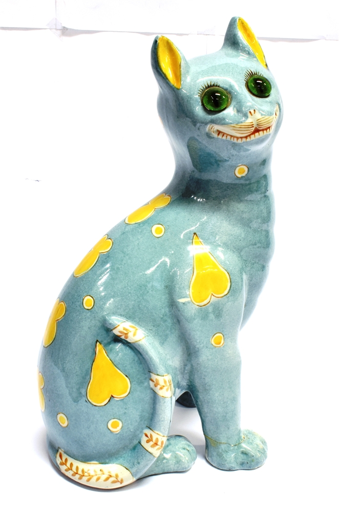 A FAIENCE POTTERY FIGURE OF A SEATED CAT IN THE MANNER OF GALLE unmarked but probably Mosanic,