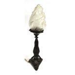 AN ART DECO STYLE TABLE LAMP the frosted glass flame shaped shade supported by a girl in gymnastic