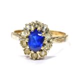 A 9CT GOLD BLUE AND WHITE STONE OVAL CLUSTER DRESS RING Ring size P, gross weight approx. 3.4