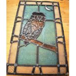 A LEADED AND STAINED GLASS WINDOW with owl and crescent moon, (damages) 60cm x 35cm