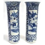 A PAIR OF CHINESE SLEEVE VASES with flared rims, the reserves painted with figures before buildings,