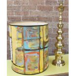 A LARGE TABLE LAMP AND SHADE with brass column base, the shade brightly decorated with an abstract