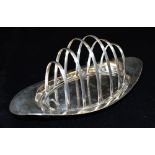 A SILVER TOAST RACK the elliptical shaped five slice toast rack, approx. 22cms long of plain