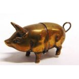 SEWING ACCESSORIES - A BRASS COTTON REEL HOLDER IN THE FORM OF A PIG 5.5cm long.