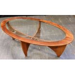 A G-PLAN OVAL 'ASTRO' COFFEE TABLE of oval form, the glass inset top 122cm x 65cm, 42cm high