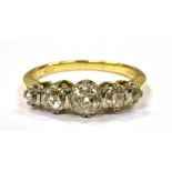 A DIAMOND FIVE STONE 18CT GOLD RING OF 1.5 CARAT Comprising five round old cut diamonds graduating