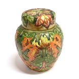 A LARGE MOORCROFT POTTERY 'FLAME OF THE FOREST' PATTERN GINGER JAR AND COVER designed by Philip