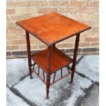 A VICTORIAN WALNUT AESTHETIC MOVEMENT WALNUT OCCASIONAL TABLE in the manner of E W Godwin, the
