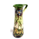 A LIMITED EDITION MOORCROFT POTTERY 'AQUILEGIA' PATTERN EWER designed by Philip Gibson, tubelined