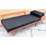A 1960S TEAK FRAMED SOFA/DAY BED the right hand hinged coffee table end opening to convert to day