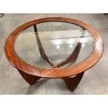 A G-PLAN CIRCULAR TEAK AND GLASS TOP 'ASTRO' COFFEE TABLE 83.5cm diameter 46cm high