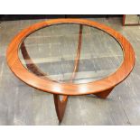 A G-PLAN CIRCULAR TEAK AND GLASS TOP 'ASTRO' COFFEE TABLE 83.5cm diameter 46cm high