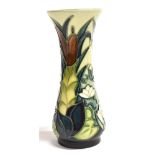 A SMALL MOORCROFT 'LAMIA' PATTERN VASE of waisted form, tubelined decoration of bulrushes, impressed