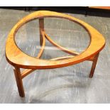 A TEAK NATHAN 'CIRCLES' STYLE OCCASIONAL TABLE with glass inset top, the shaped triangular top