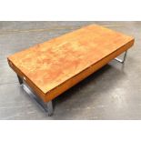 A 'TANSAD' TEAK LOW COFFEE TABLE on steel sledge feet, the oblong top 60cm x 120cm, 33cm high