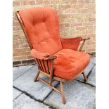 AN ERCOL MODEL 1913 'EVERGREEN' UPHOSLTERED STICKBACK WINDSOR ARMCHAIR with original upholstery, the