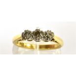 A DIAMOND THREE STONE 18CT GOLD RING the three round brilliant cut diamonds weigh a total of approx.