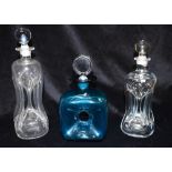 A HOLMEGAARD GLASS 'GLUG GLUG' DECANTER AND STOPPER and two others